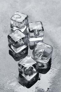 Image of five cubes of ice melting