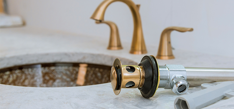 Plumbing parts on a sink countertop