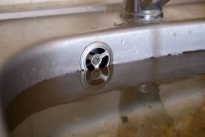 Clogged drain damaging a sewer line,