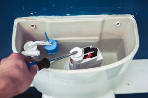 fixing toilet as do-it-yourself plumbing project