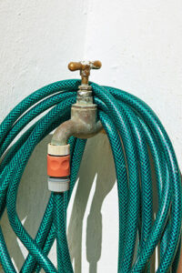 hose that needs seasonal plumbing maintenance